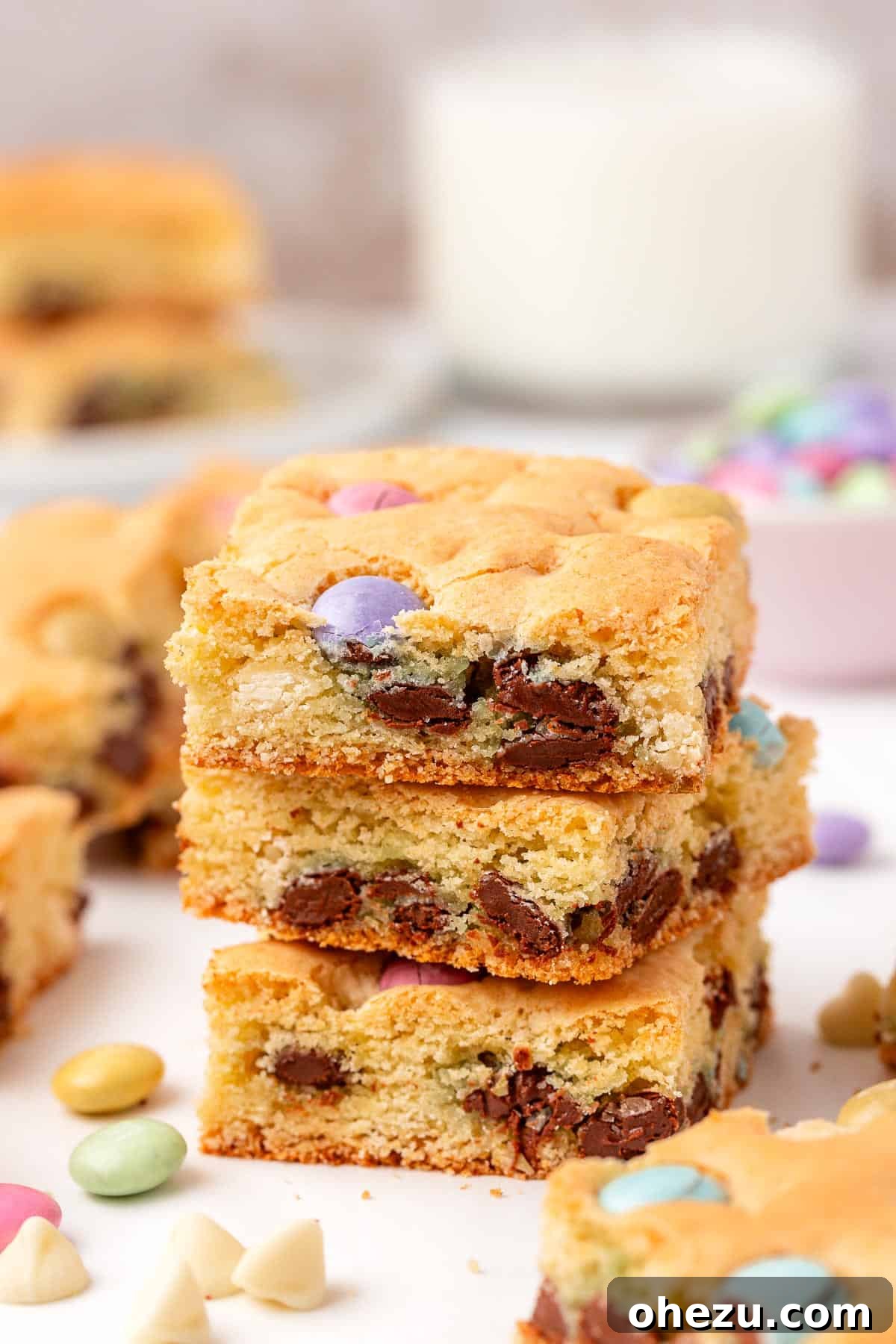 Stacked Easter cookie bars showing their layers and colorful candy.