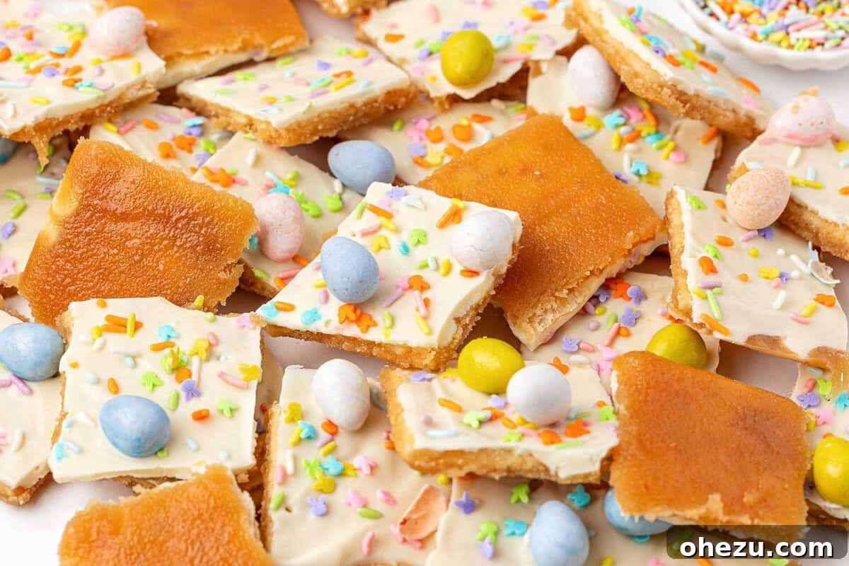 Finished Easter Crack saltine toffee with colorful Cadbury Mini Eggs and sprinkles, poised to set