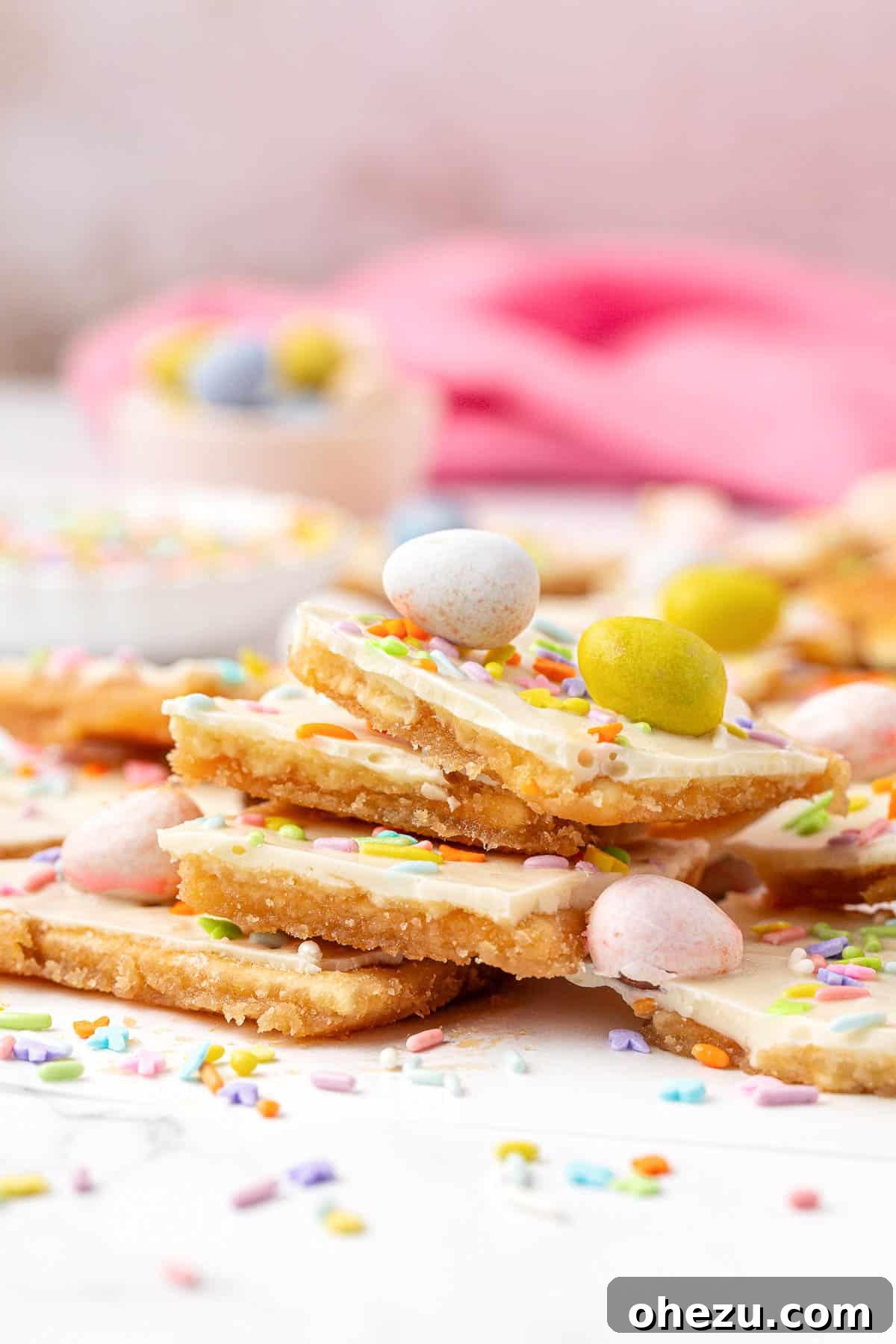 A vibrant pile of Easter crack saltine toffee pieces, showcasing the varied textures and colorful candies