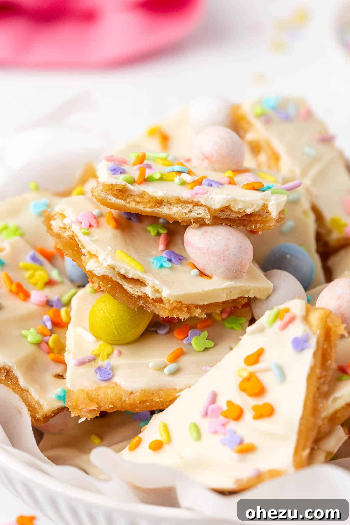 Close-up of irresistible Easter crack saltine toffee pieces featuring vibrant Cadbury Mini Eggs and sprinkles