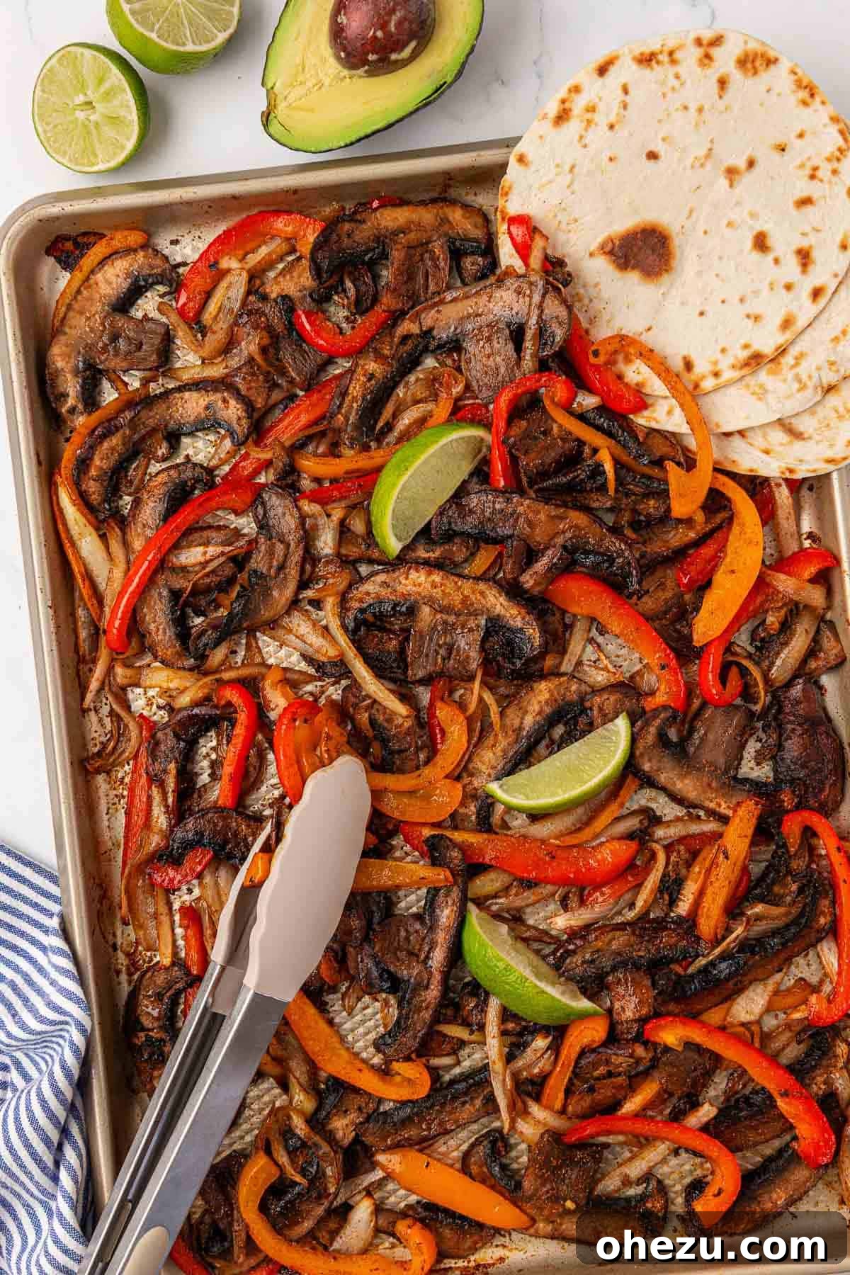 Smoky Portobello Fajita Sizzle 2 Roasted portobello mushrooms, bell peppers, and onions ready to be served as fajitas