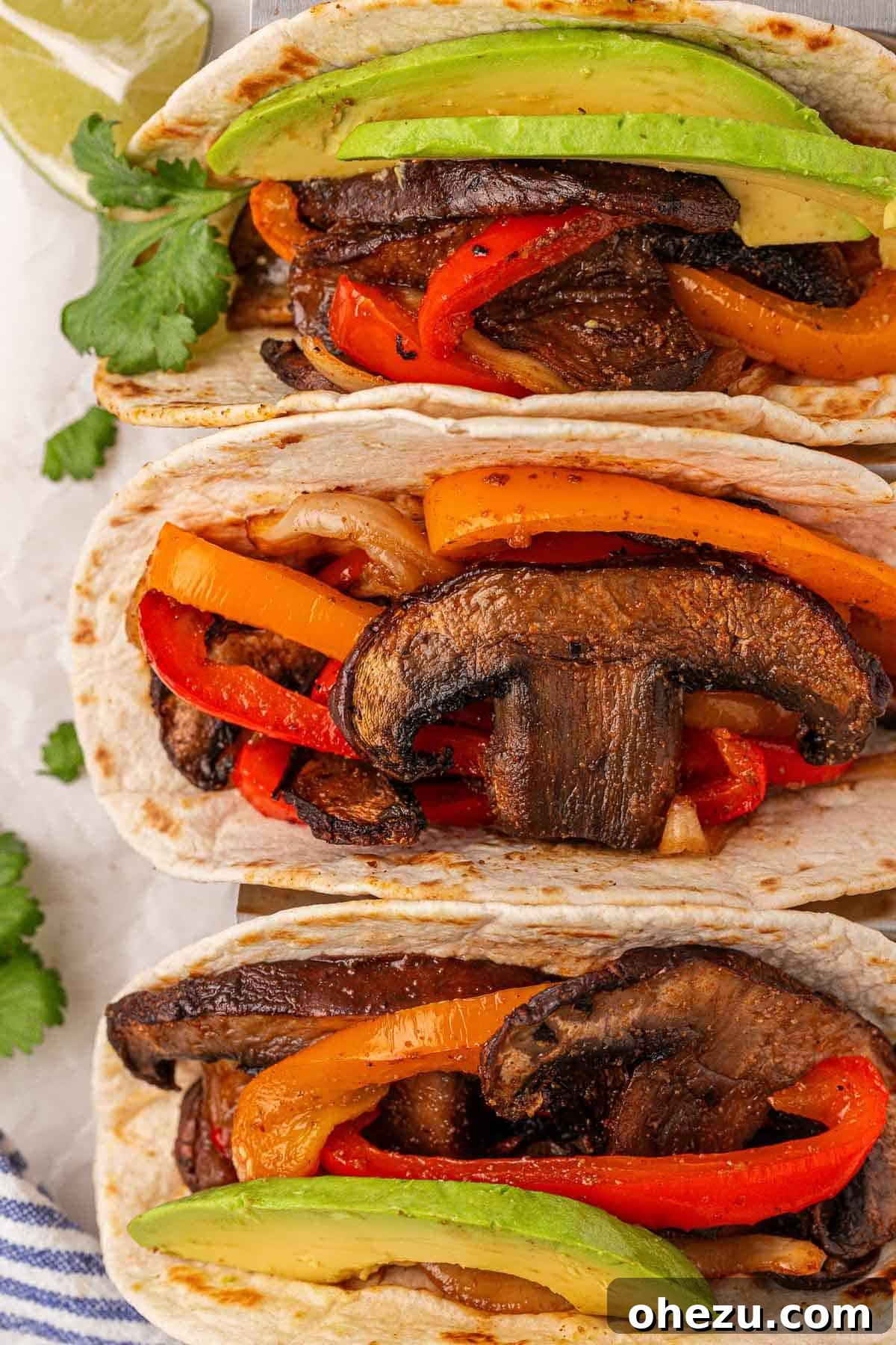 Smoky Portobello Fajita Sizzle 12 A delicious platter of portobello mushroom fajitas served with warm tortillas and fresh avocado