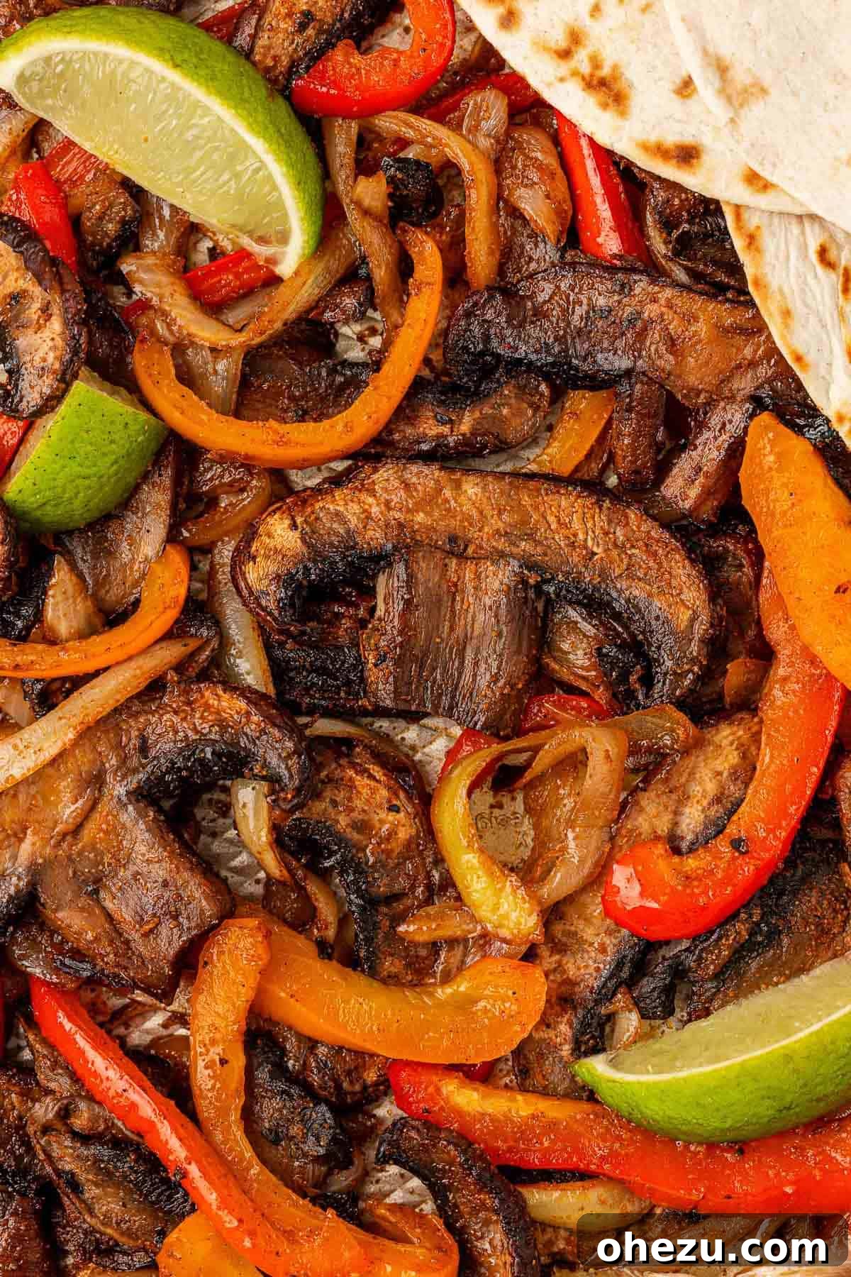 Smoky Portobello Fajita Sizzle 13 Close-up of roasted portobello mushrooms, bell peppers, and onions, showing perfect charring