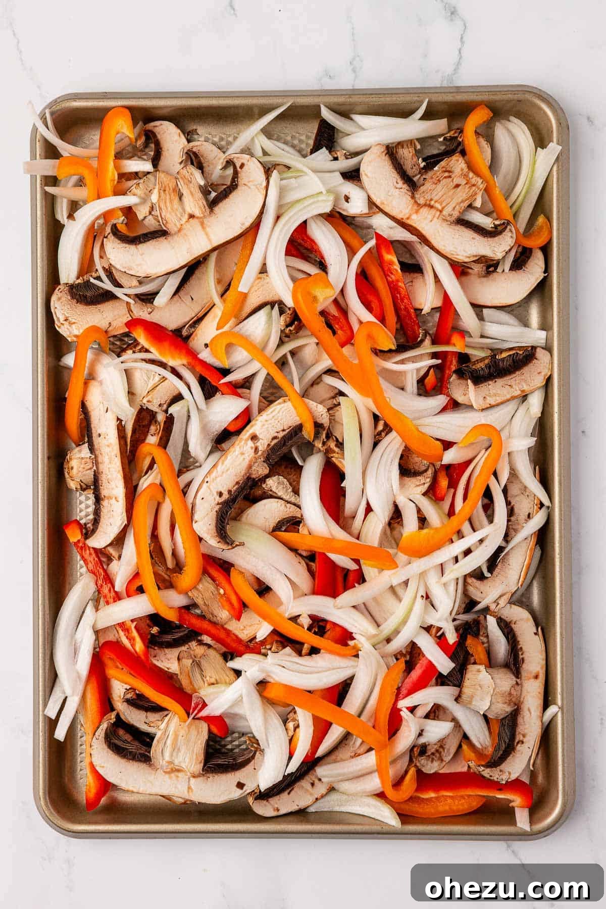 Smoky Portobello Fajita Sizzle 6 Assortment of vibrant portobello mushroom fajita vegetables on a baking sheet