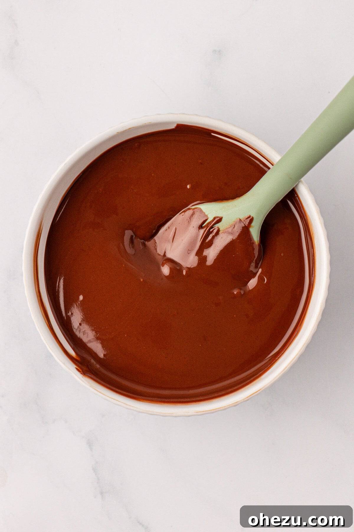 Chewy Peanut Butter Rice Krispie Bars Recipe 12 melted chocolate in a mixing bowl