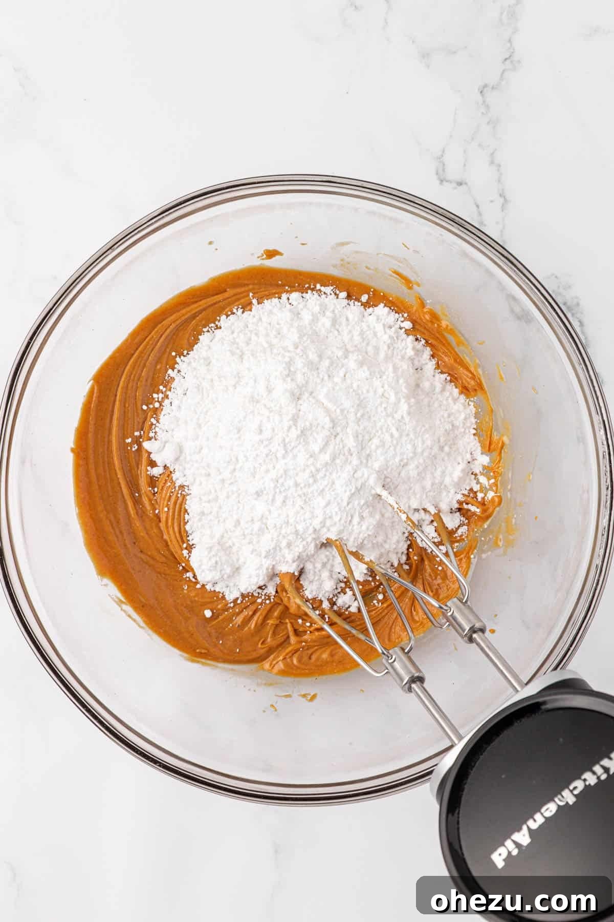 Chewy Peanut Butter Rice Krispie Bars Recipe 7 adding the powdered sugar to the peanut butter mixture