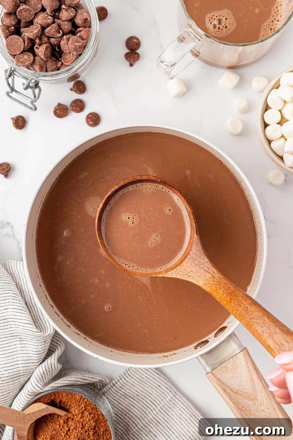How to Make Rich Homemade Hot Chocolate 3 a ladle with hot chocolate over a pot