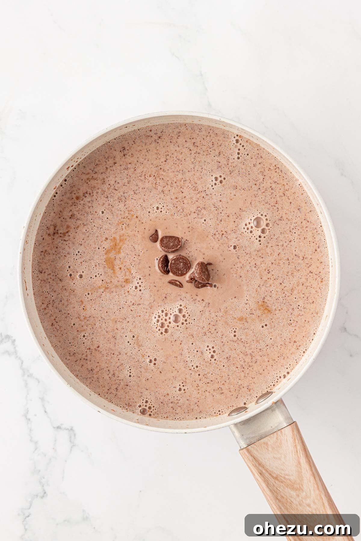 How to Make Rich Homemade Hot Chocolate 7 adding the chocolate chips to the sauce pan