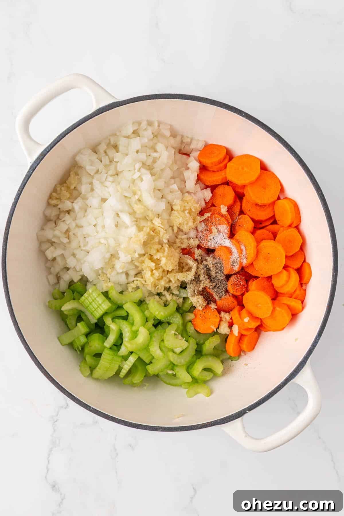 garlic, onion, carrots, celery, and spices in a pot