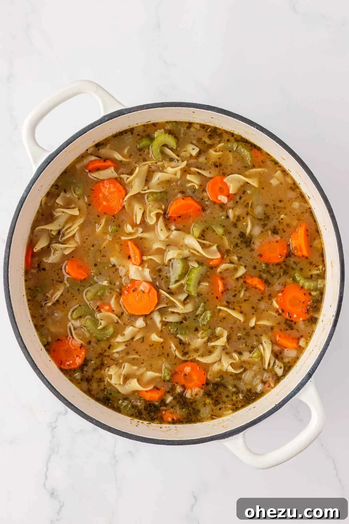 a pot full of vegetable noodle soup